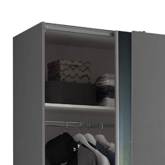 Gray wardrobe with clothes on hangers and folded items inside on a white background