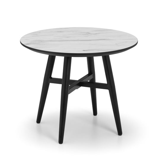 Round table with white top and black legs on a white background