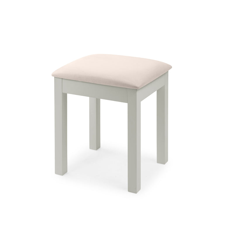 Small stool with a beige cushion on a white background