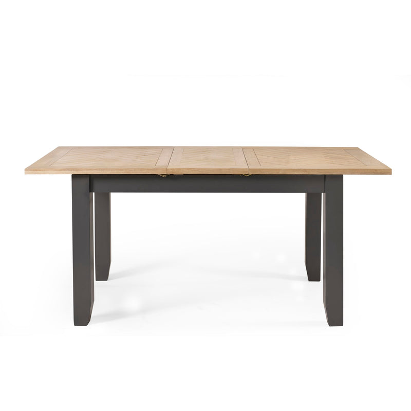 Wooden table with black base on a white background