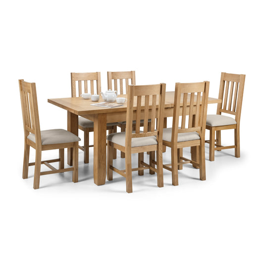 Wooden dining table with six matching chairs on a white background