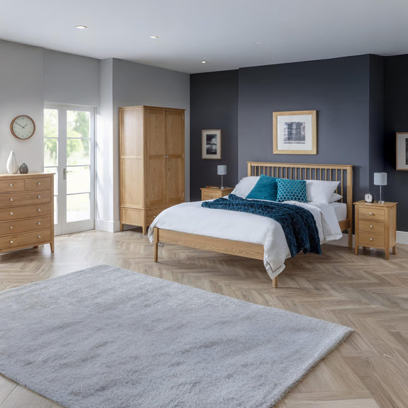 Modern bedroom with wooden furniture, bed, and decor