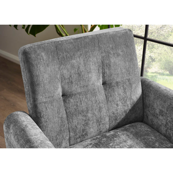 Gray upholstered chair with a textured fabric finish in a room setting.