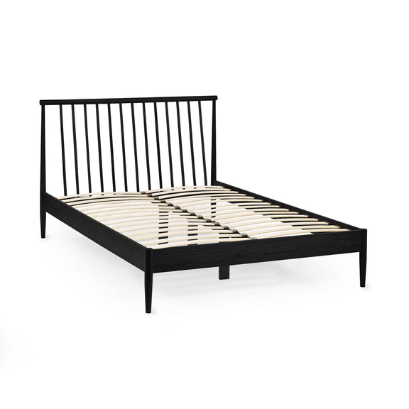 Black metal bed frame on a white background