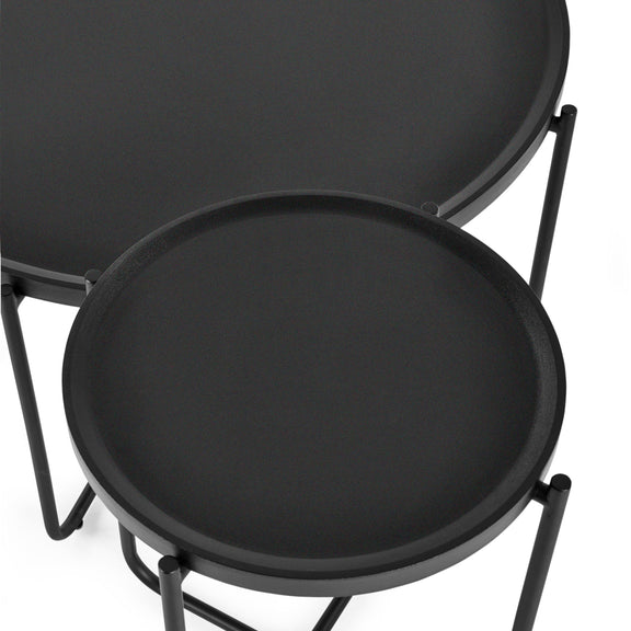 Two black round tables with metal frames on a white background