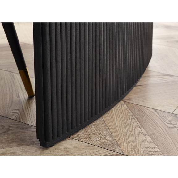 Black radiator on a wooden floor