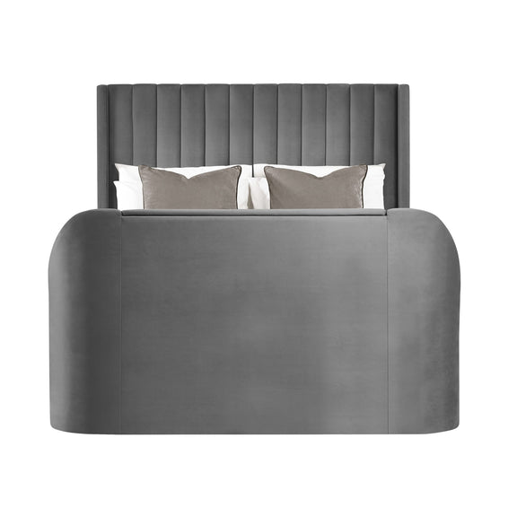 Gray upholstered bed with tufted headboard on a white background