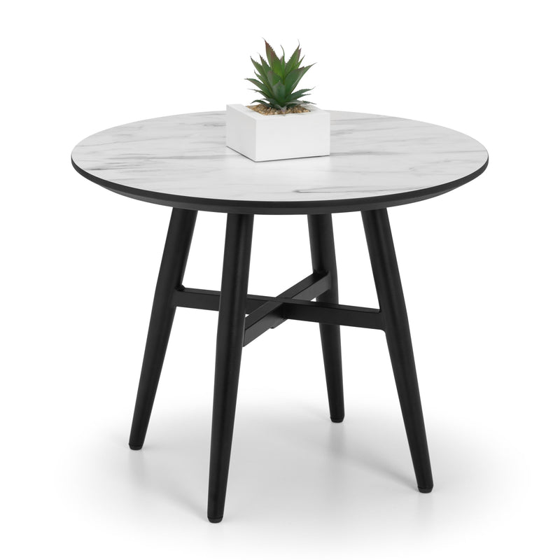 Round table with white top and black legs on a white background
