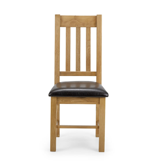 Wooden chair with a black leather seat on a white background