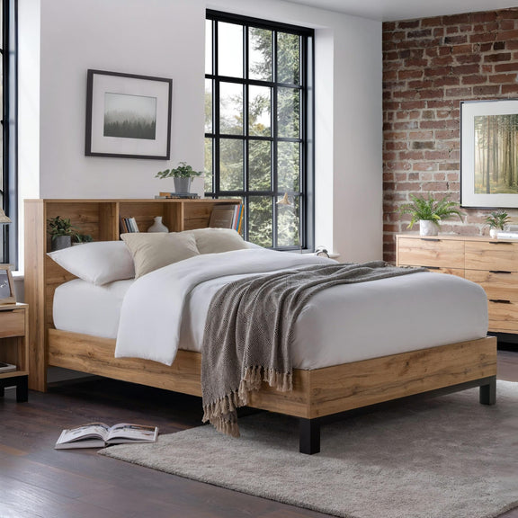 Wooden bed in a bedroom with a brick wall and large window