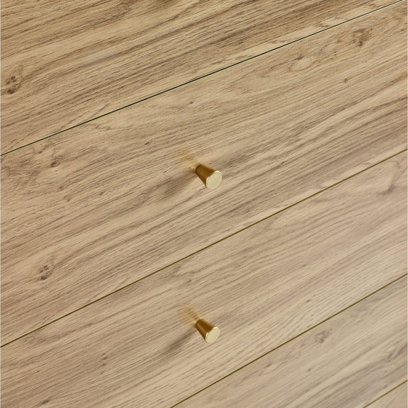 Close-up of wooden flooring with a gold accent