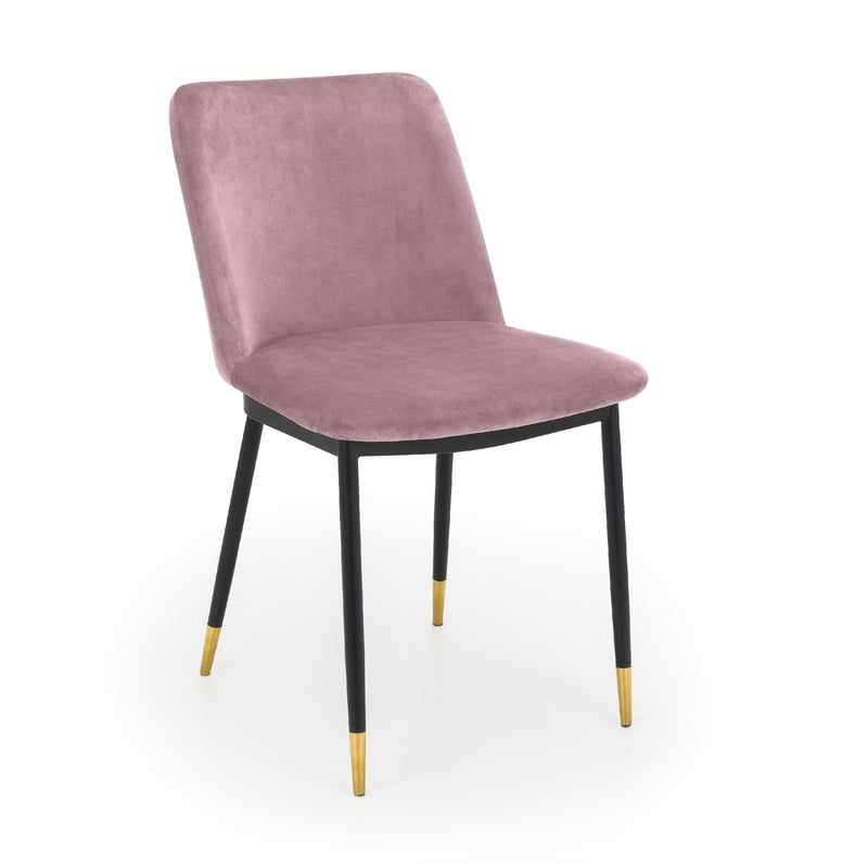 Pink velvet chair with black legs and gold foot caps on a white background