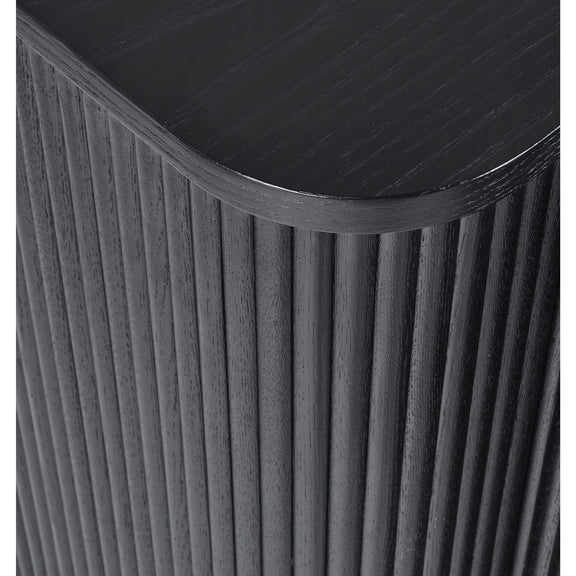 Close-up of a black cylindrical object with ribbed texture