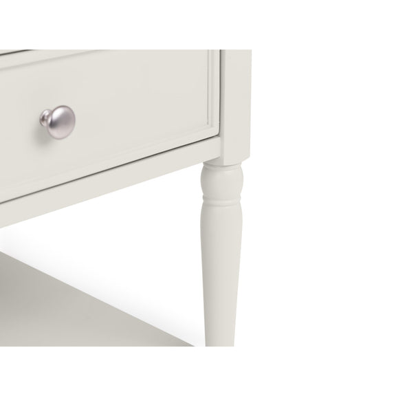 White side table with a drawer and silver handle on a white background