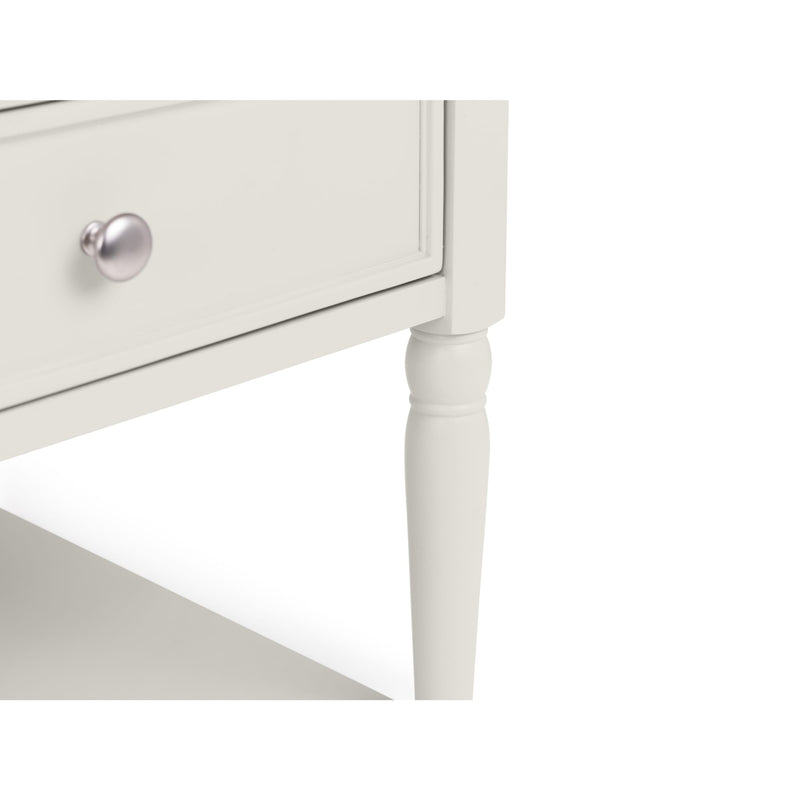 White side table with a drawer and silver handle on a white background