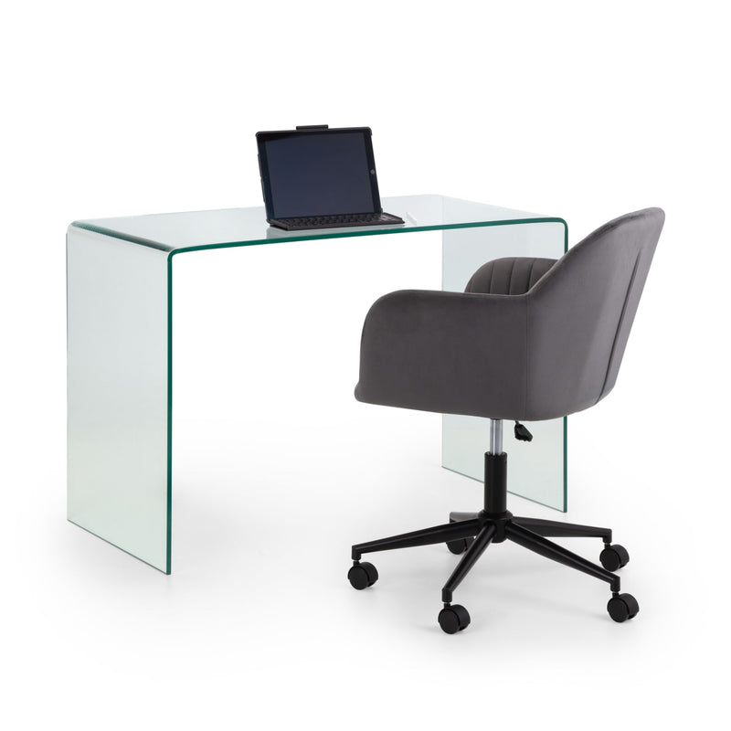 Glass desk with a laptop and a gray office chair on a white background