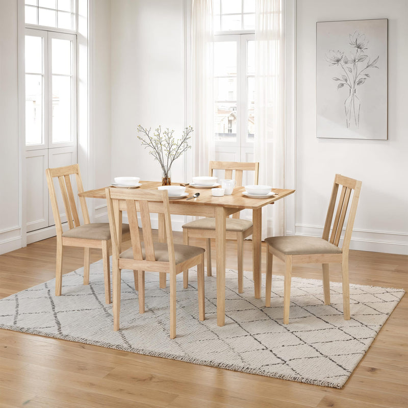 Dining room with wooden table and chairs on a patterned rug