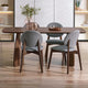 Dining table with four chairs in a modern interior setting
