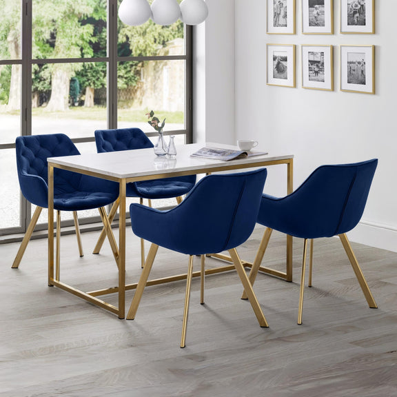 Dining room with a table and four blue chairs in a modern setting.