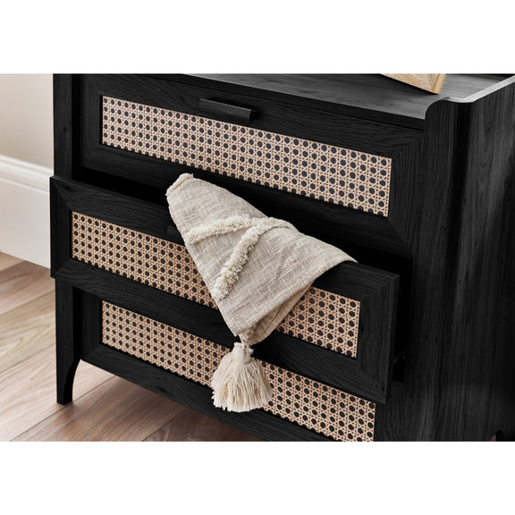 Black 3 drawer chest with drawer open storing clothing and accessories