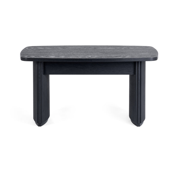 Modern side table with a dark gray marble top and black ribbed base on a white background
