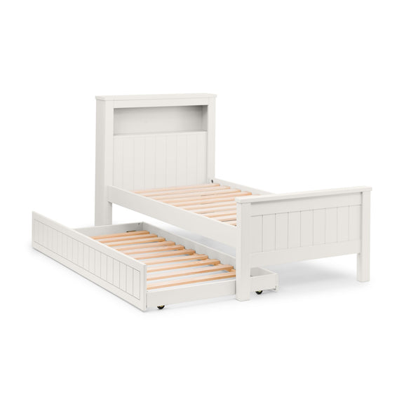 White wooden bed with a pull-out trundle on a white background