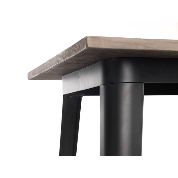 Close-up of a table with a wooden top and black metal legs on a white background
