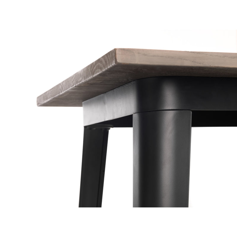 Close-up of a table with a wooden top and black metal legs on a white background