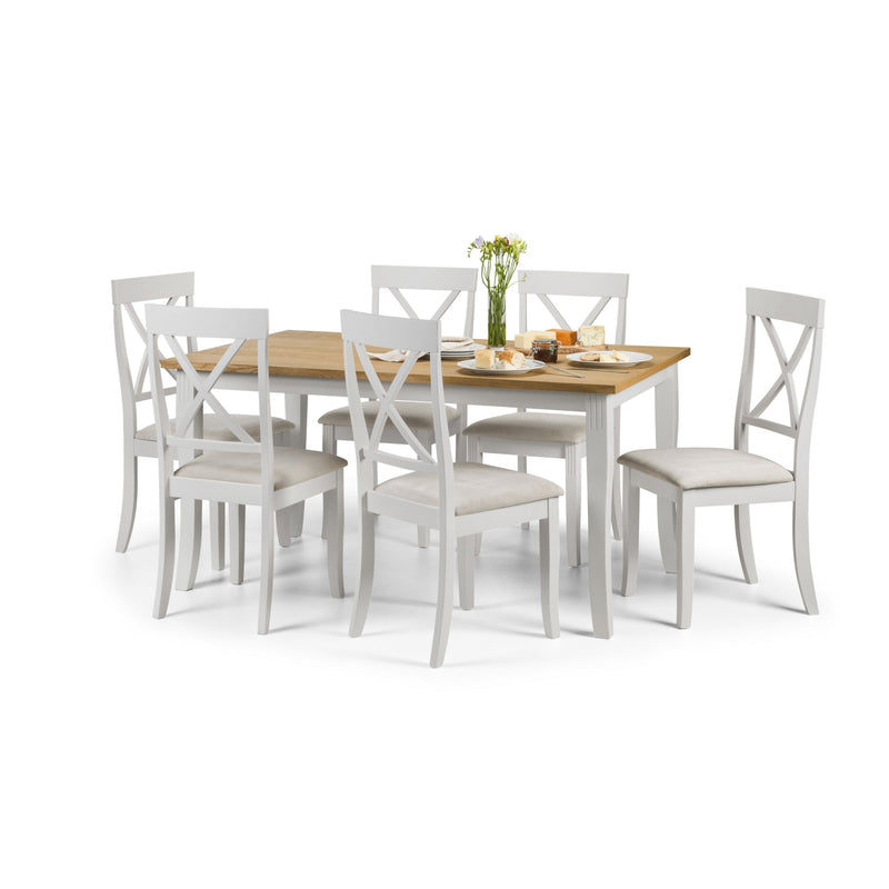 Dining table set with six chairs on a white background