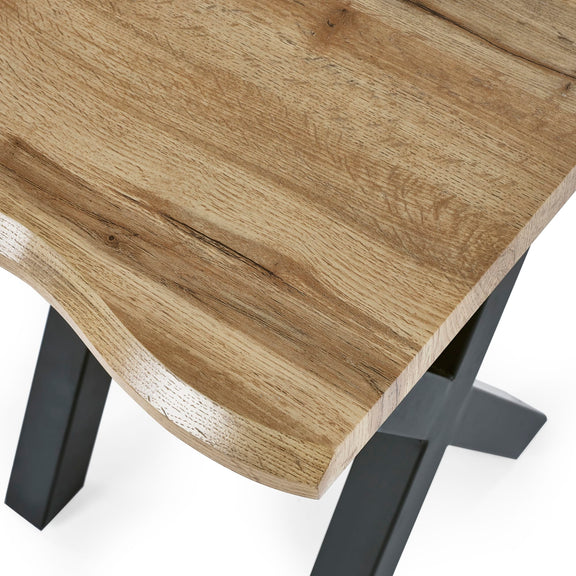 Wooden table top with black metal legs on a white background