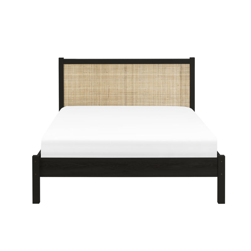 Bed with black frame and woven headboard on a white background