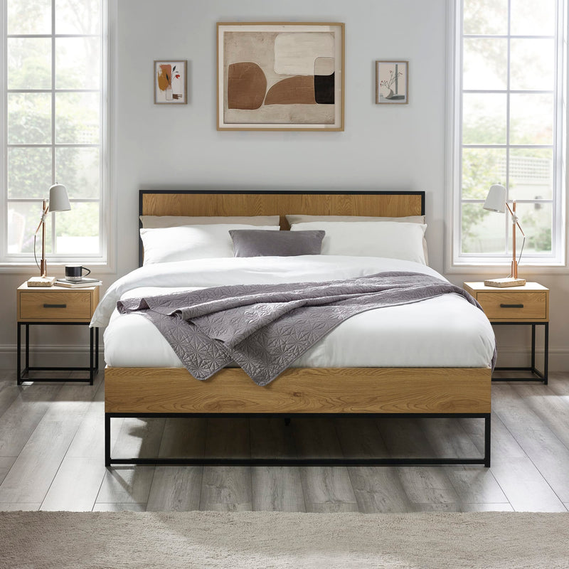 Wooden bed with white bedding in a modern bedroom setting