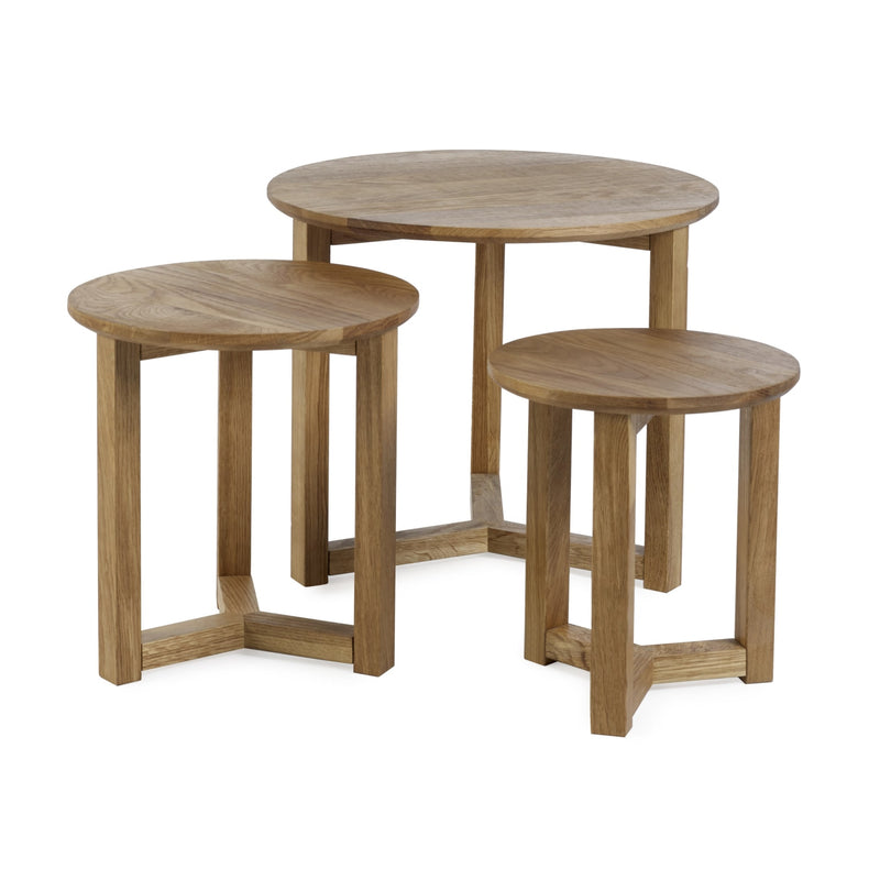 Set of three wooden nesting tables on a white background