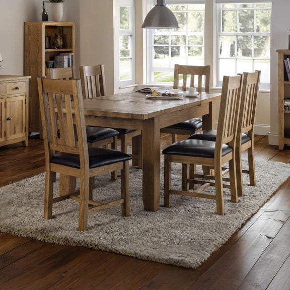 Dining room with wooden table and chairs on a rug