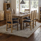 Dining room with wooden table and chairs on a rug