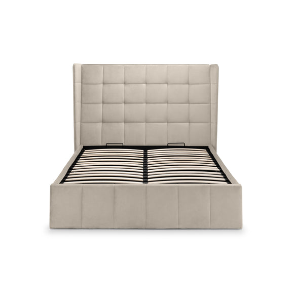 Beige upholstered bed frame with a tufted headboard on a white background