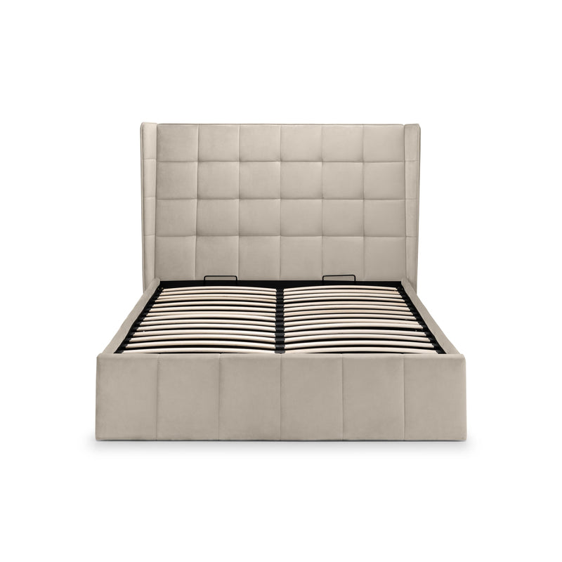 Beige upholstered bed frame with a tufted headboard on a white background