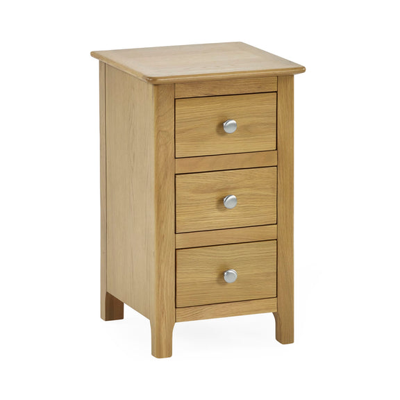 Wooden nightstand with three drawers on a white background