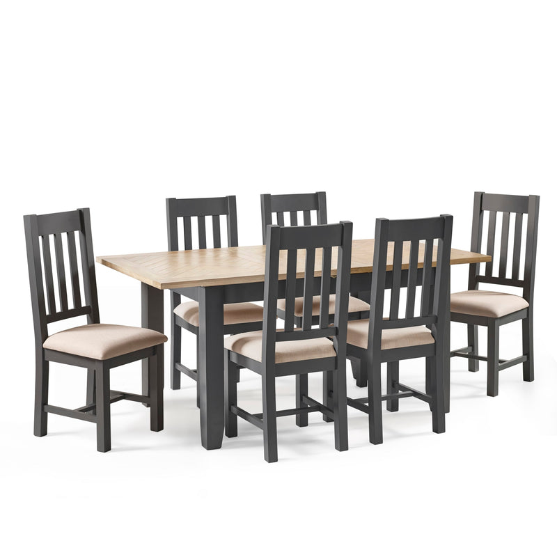 Dining table set with six chairs on a white background
