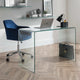 Modern office setup with a glass desk, blue chair, and laptop.