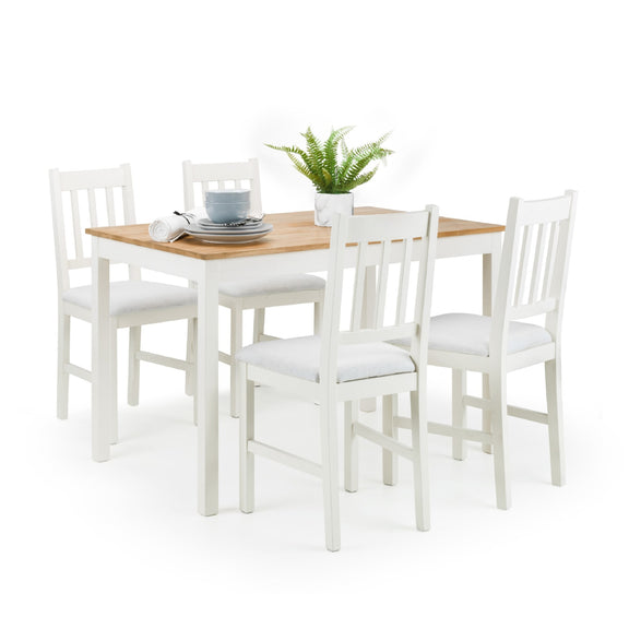 Dining set with wooden table and white chairs on a white background