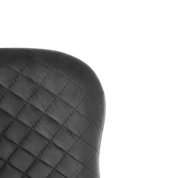 Black quilted chair cushion on a white background