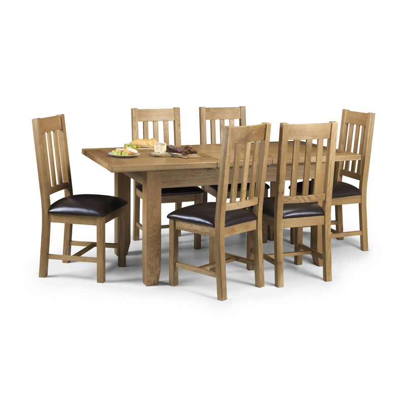 Wooden dining table with six matching chairs on a white background