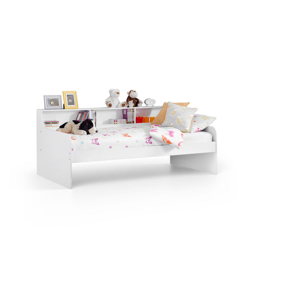 White children's bed with bedding and toys on a white background