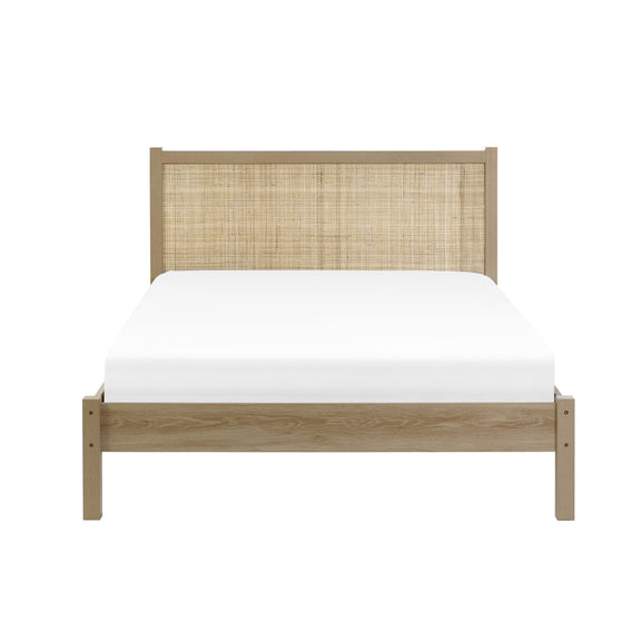 Wooden bed with woven headboard on a white background