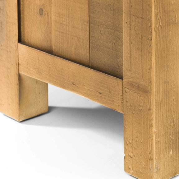 Close-up of a wooden cabinet corner on a white background