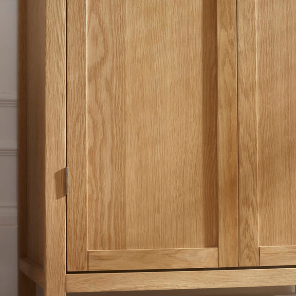 Wooden wardrobe with two doors in a neutral setting
