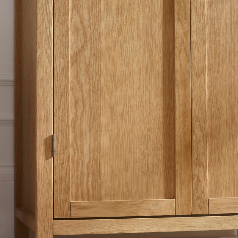 Wooden wardrobe with two doors in a neutral setting