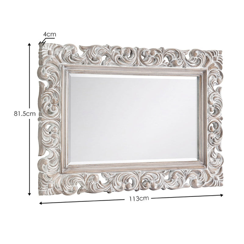 Decorative mirror with intricate frame and measurement details on a white background