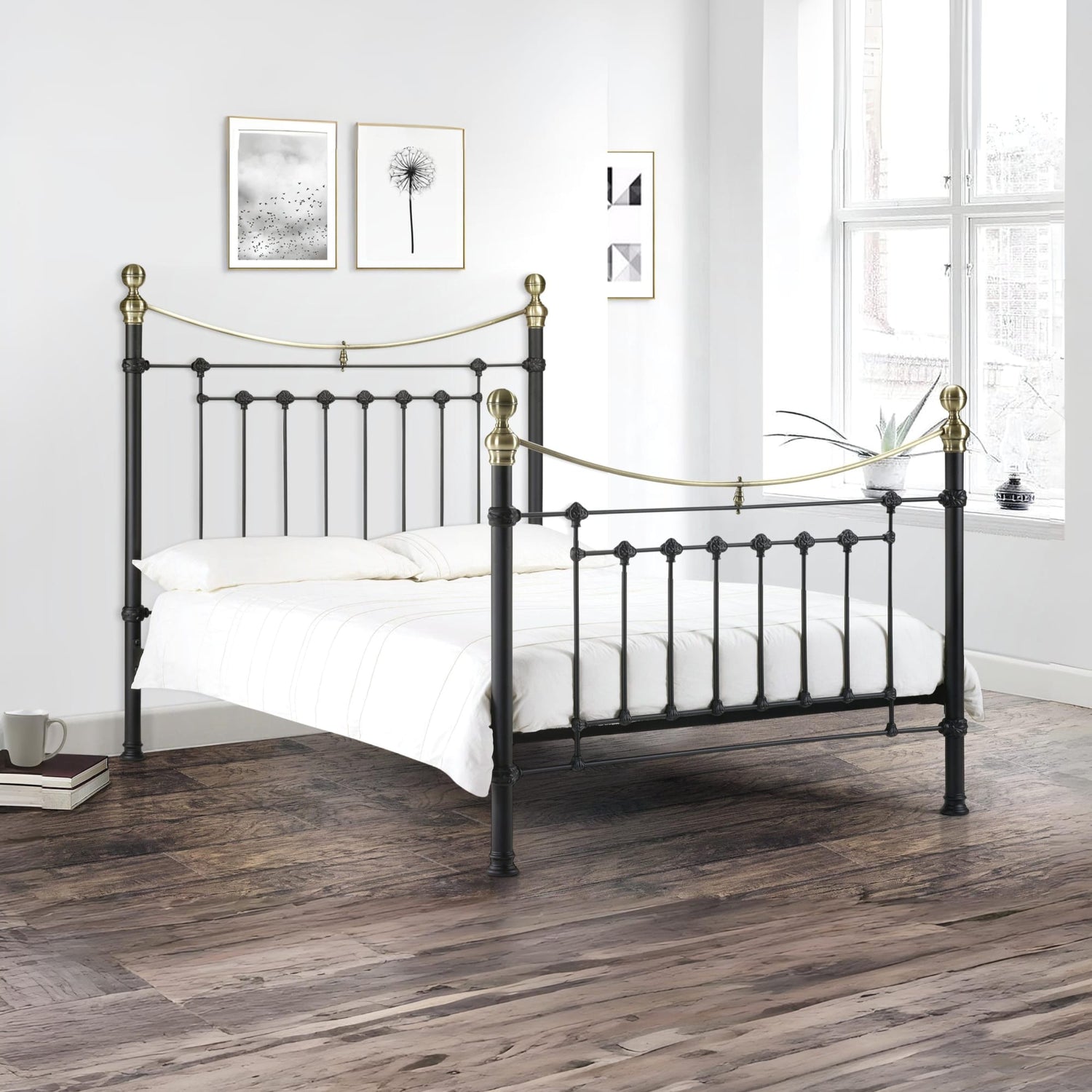 Black metal bed with gold accents in a bedroom setting